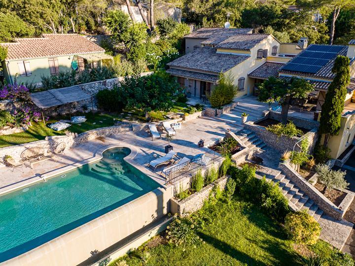 Aerial view of the house, terrace, and pool